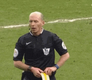 mike-dean-yellow-card.gif